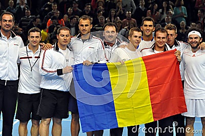 Davis Cup, the Romanian players are celebrating the victory with the Romanian flag