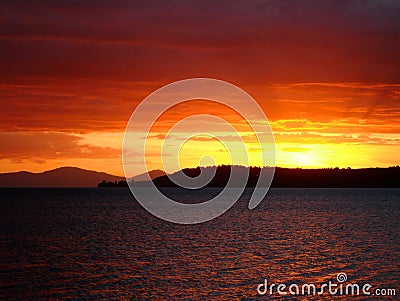 Deep red sunset over Lake Taupo, New Zealand