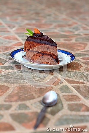 A delicious chocolate sponge cake on the dish delicious.