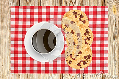 Delicious raisins and chocolate cake with cup of coffee on napki