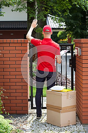 Delivery man delivering packages to home