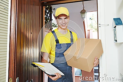 Delivery man with parcel box indoors