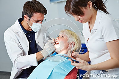 Dental assistant during apprenticeship at treatment