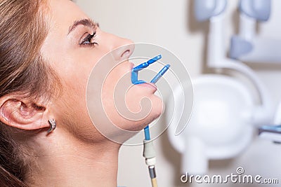 Dentist carrying out a thorough examination. Female patient.