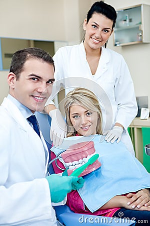 Dentist teaching to brush teeth