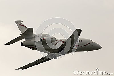 Departing International Jet Management Dassault Falcon 900EX aircraft in the rainy day