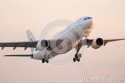 Departing MASkargo Airbus A330-223F aircraft in the sunset rays