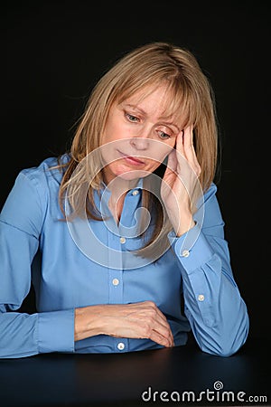 Depressed blonde older woman