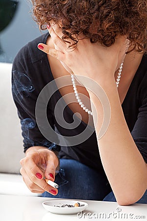 Depressed smoking woman