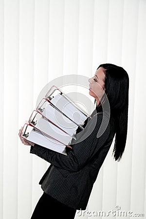 Deprived women with stress and files in the office