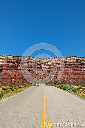 Desert highway leading into mountains