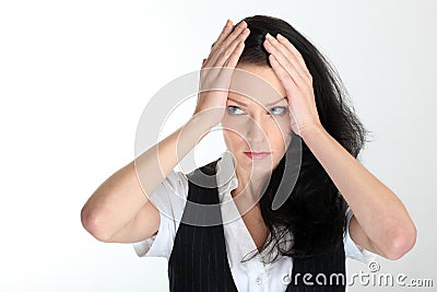 Desperate young business woman under pressure with hands on temples