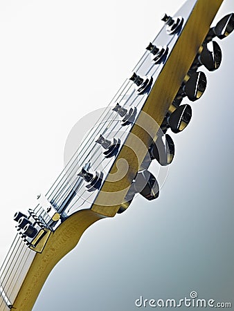 Detail of electric guitar cords and frets