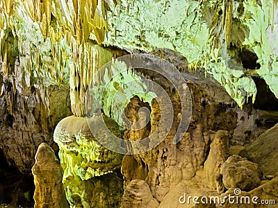 Detail of lluminated cave wall with a lot of amazing natural decorations, Homolje mountains
