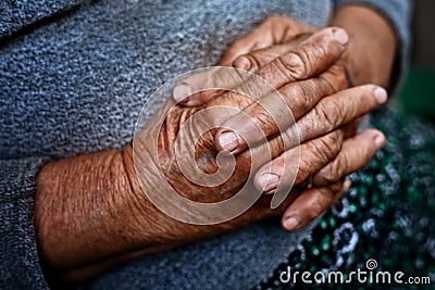 Detail on old hands of senior wrinkled woman