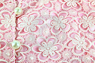 Detail of pink lace fabric with pearl