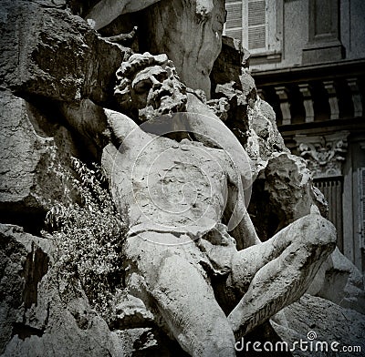 Detail of a sculpture of a man lying on his back