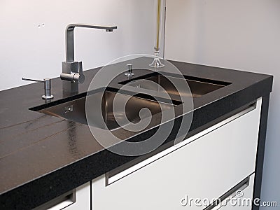 Details of modern kitchen sink with tap faucet