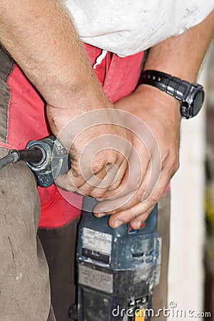 Detal of worker hands by the work