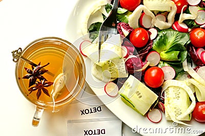 Detox diet with veggie salad and herbal tea