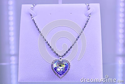 Diamond necklace with large heart-shaped diamond.