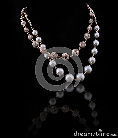 Diamond necklace with white and yellow pearl