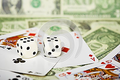 Dices are on cards and money