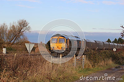 Diesel locomotive with coal train in countryside