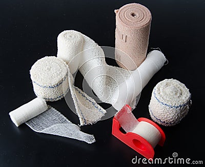 Different rolls of medical bandages and sticking plaster