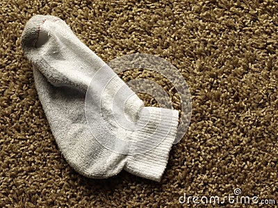 Dirty sock on the floor