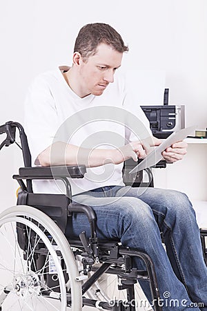 Disabled man in wheelchair at work