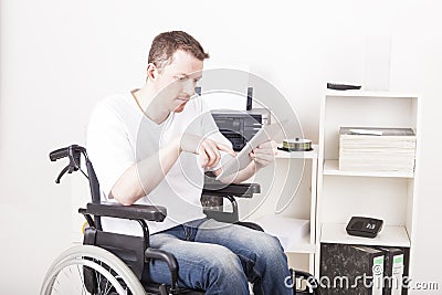 Disabled man in wheelchair at work