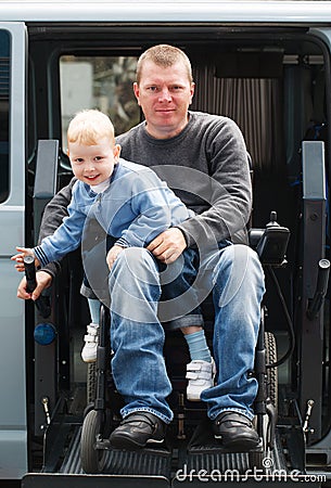 Disabled Men with son on Wheelchair Lift