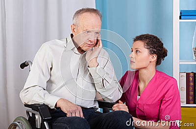 Disabled talking with a nurse and grieves