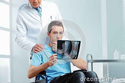 Disabled young man at doctor office