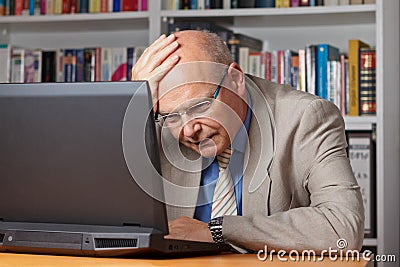 Disappointed man with laptop