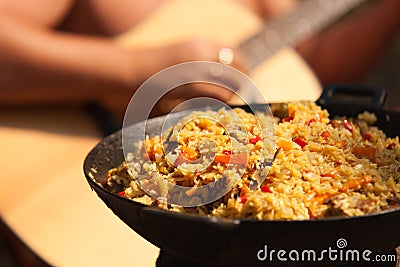 Dish with Afghan Plov with guitar playing guy