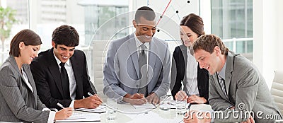 A diverse business group studying a budget plan