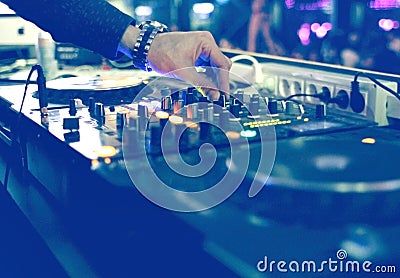 DJ mixing desk at party