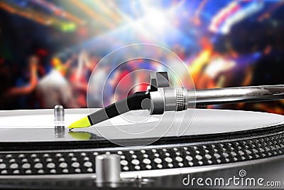 Dj turntable with vinyl record in the dance club