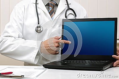 Doctor with blank laptop screen