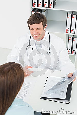 Doctor in conversation with female patient in medical office