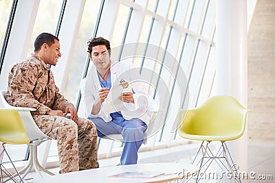 Doctor Counselling Soldier Suffering From Stress