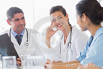 Doctor discussing with nurse and colleague