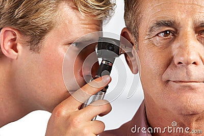 Doctor Examining Male Patient s Ears