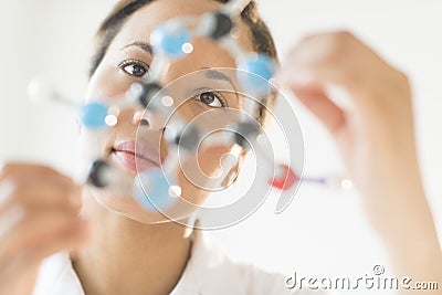 Doctor Examining Molecular Structure In Laboratory