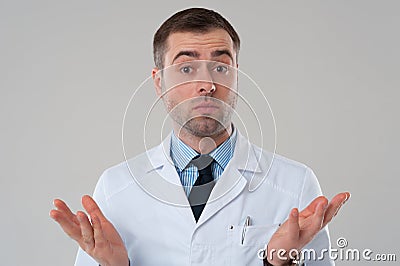 Doctor man shrug with raised hands. Expert opinion