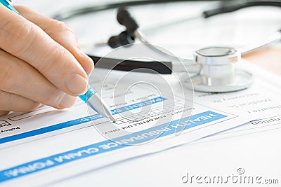 Doctor with Medical Claim Form and Stethoscope