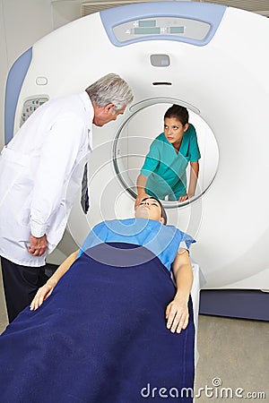 Doctor and nurse with patient at MRI in radiology
