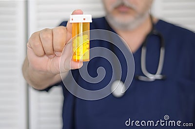 Doctor with pill bottle